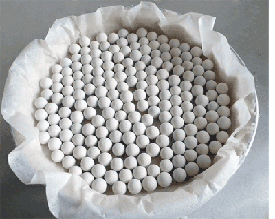 Pastry case filled with greaseproof paper and baking beads, ready for blind baking