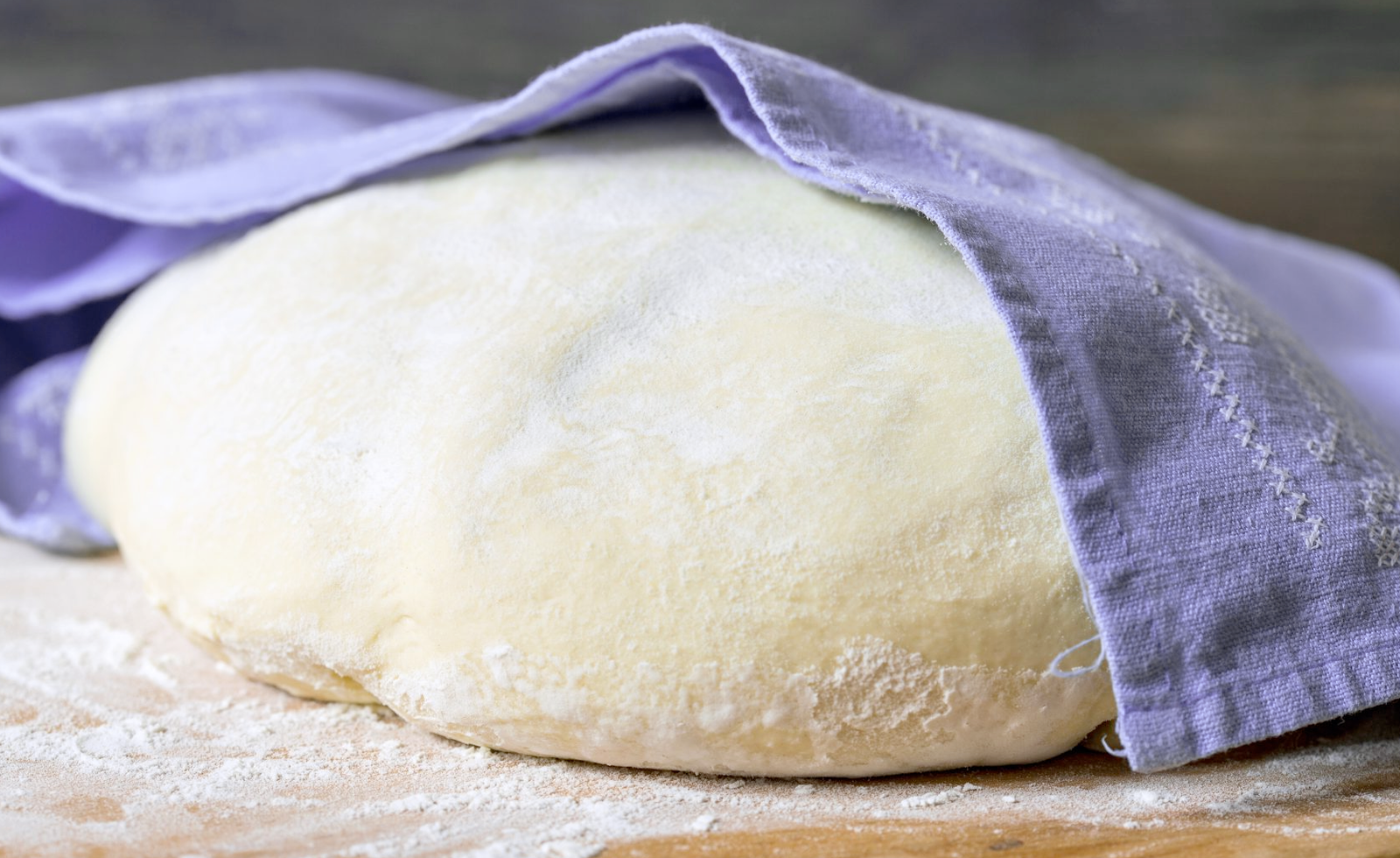 Bread dough set to prove under a cloth