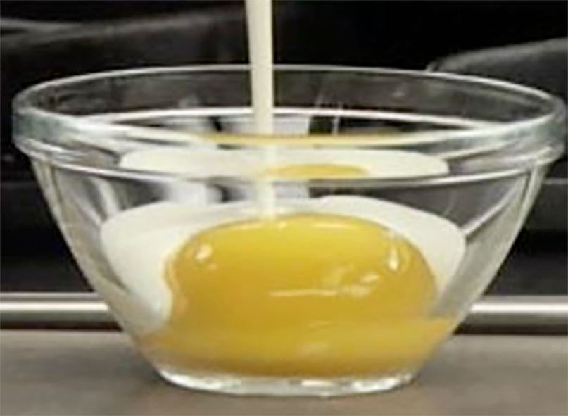 Liaison of cream and egg in glass bowl