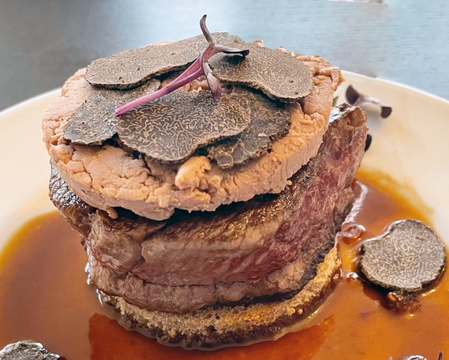 Beef fillet served with a garnish of foie gras and truffles