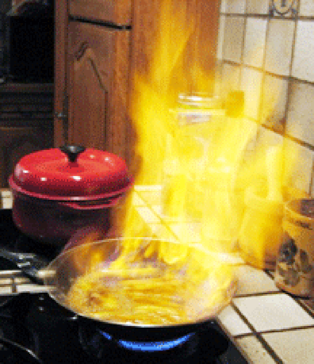 Flamber, burning off excess alcohol from a frying pan