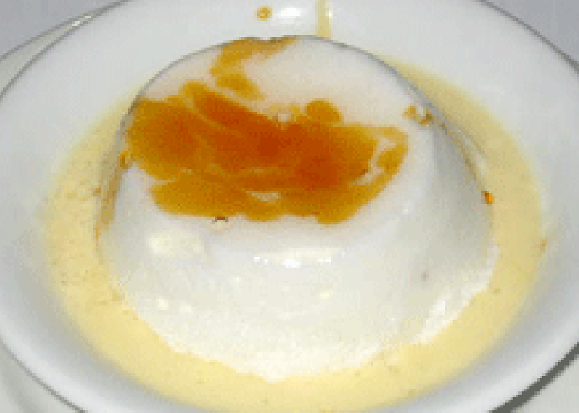 Ile Flottante light meringue served on a custard base in a dessert bowl