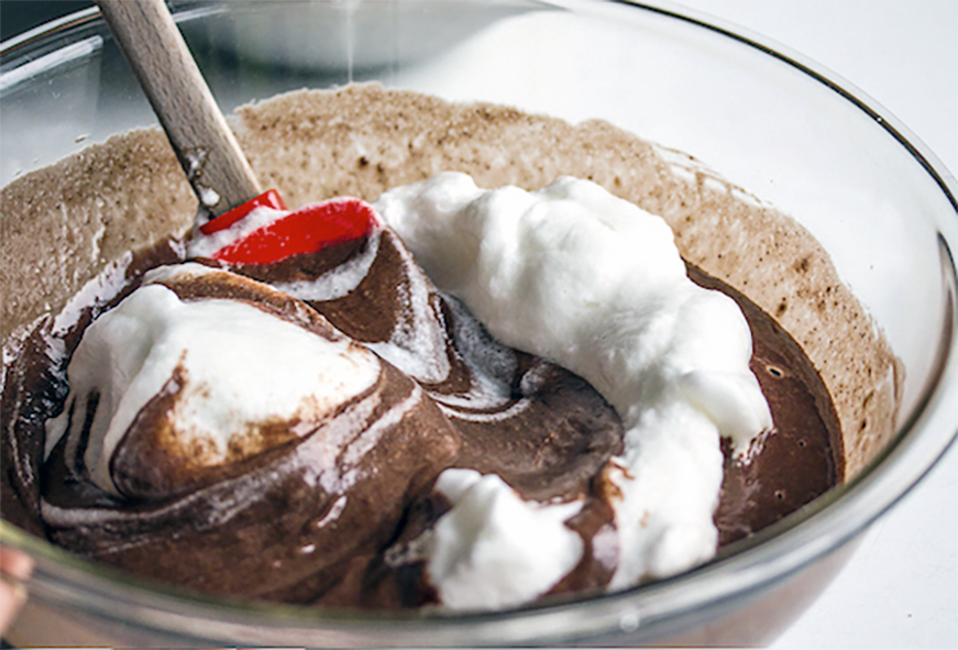 Beaten egg whites folded into melted chocolate