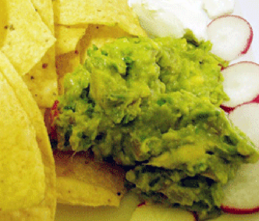 Avocado guacamole served with corn chips