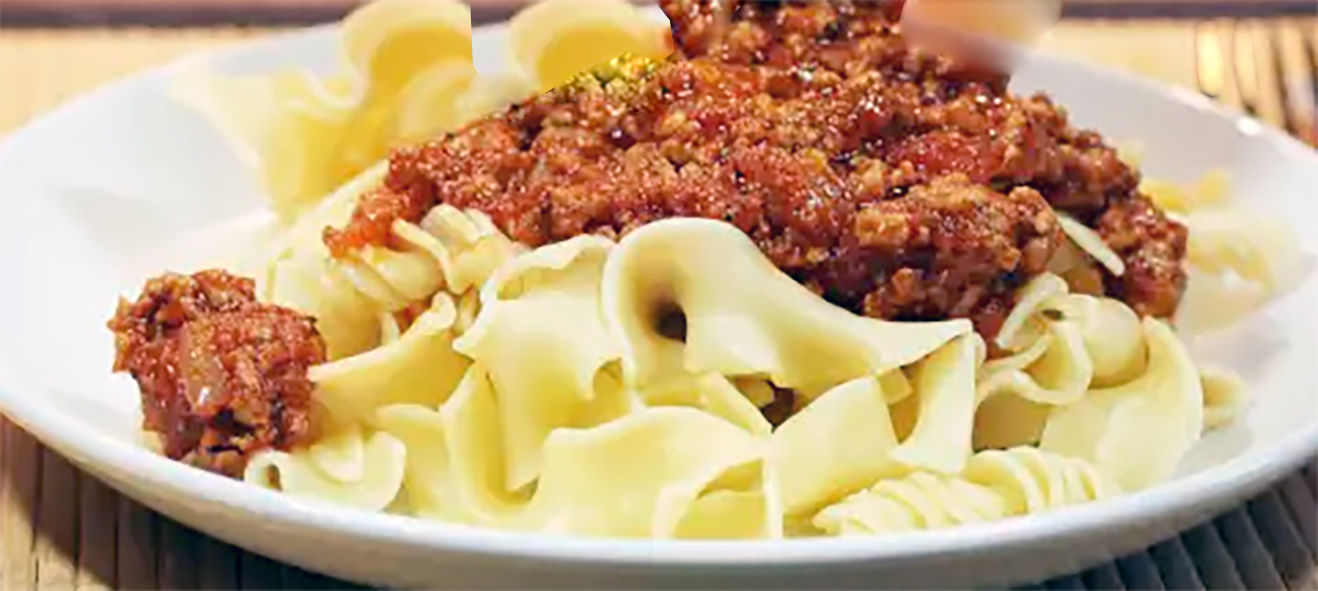 Milanese sauce served on a bed of broad noodles