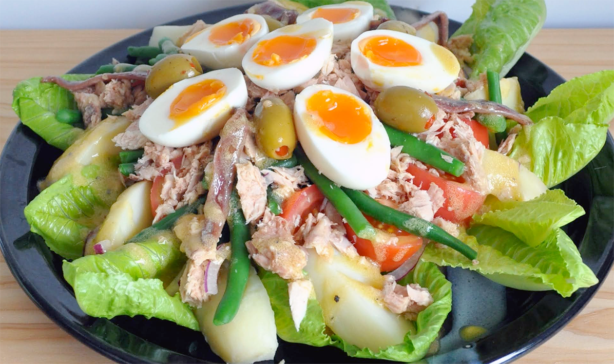 Salade Nicoise arranged on a plate