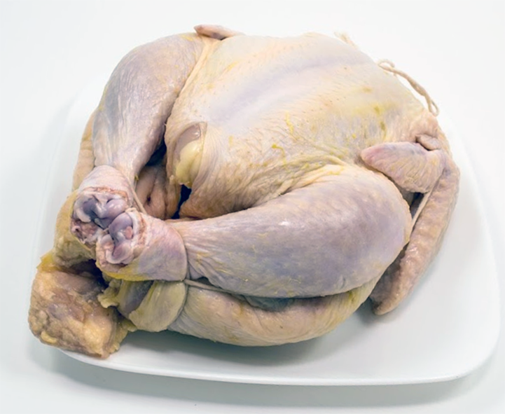 Chicken trussed with string and ready for roasting