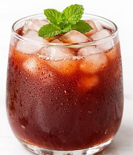 plum sharbat in a glass with ice