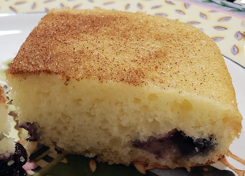 rectangular piece of Amish blueberry cake on a plate