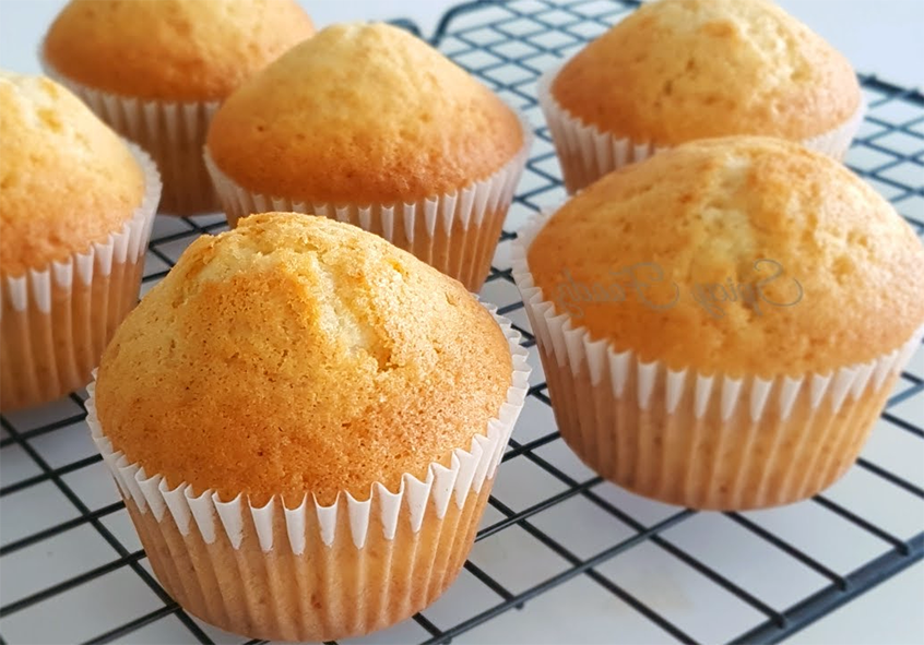 angelica muffins cooling on a wire rack