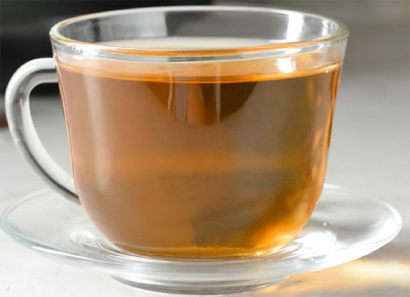 angelica root tea in a glass cup