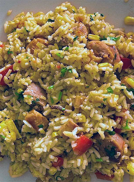 rice cooked with pork, sausagemeat and onion in a tomato base served on a plate