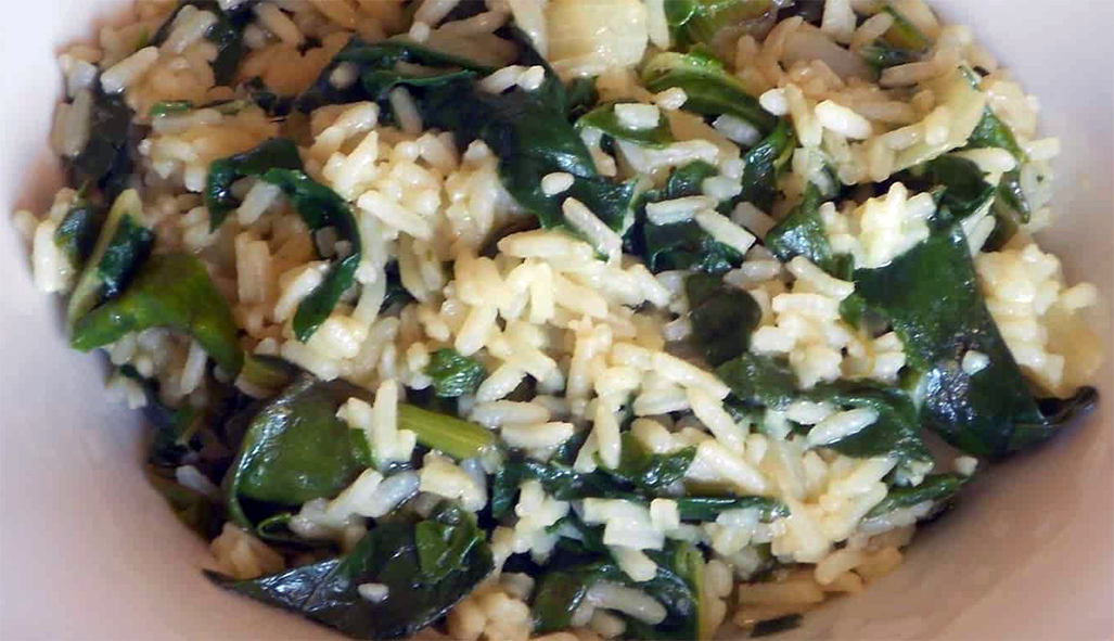 rice with moringa leaves served in a bowl