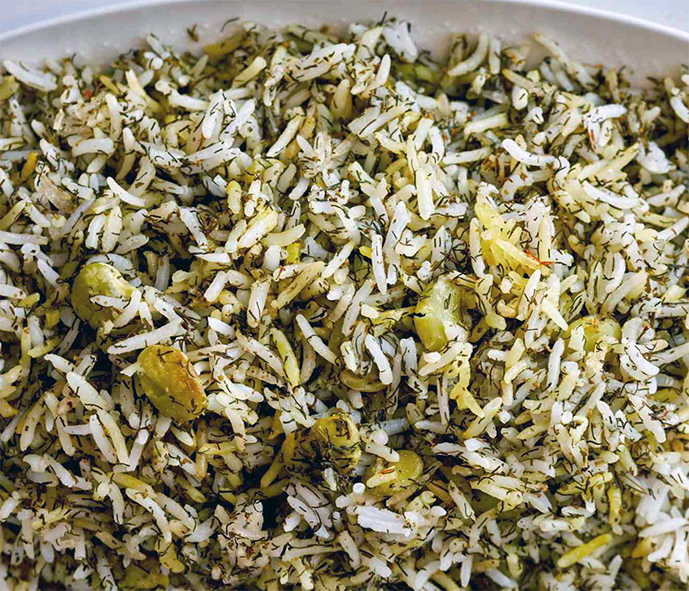 Persian dill pilau rice with beans in a serving dish