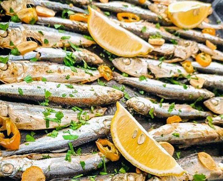 whole smoked sprats cooked on a baking tray