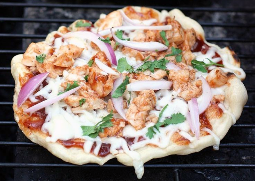 pizza cooking on a barbecue