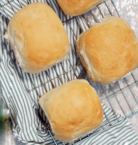 soft barm cake rolls on a wire rack