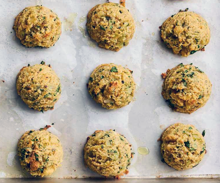 white bread stuffing balls on a baking tray