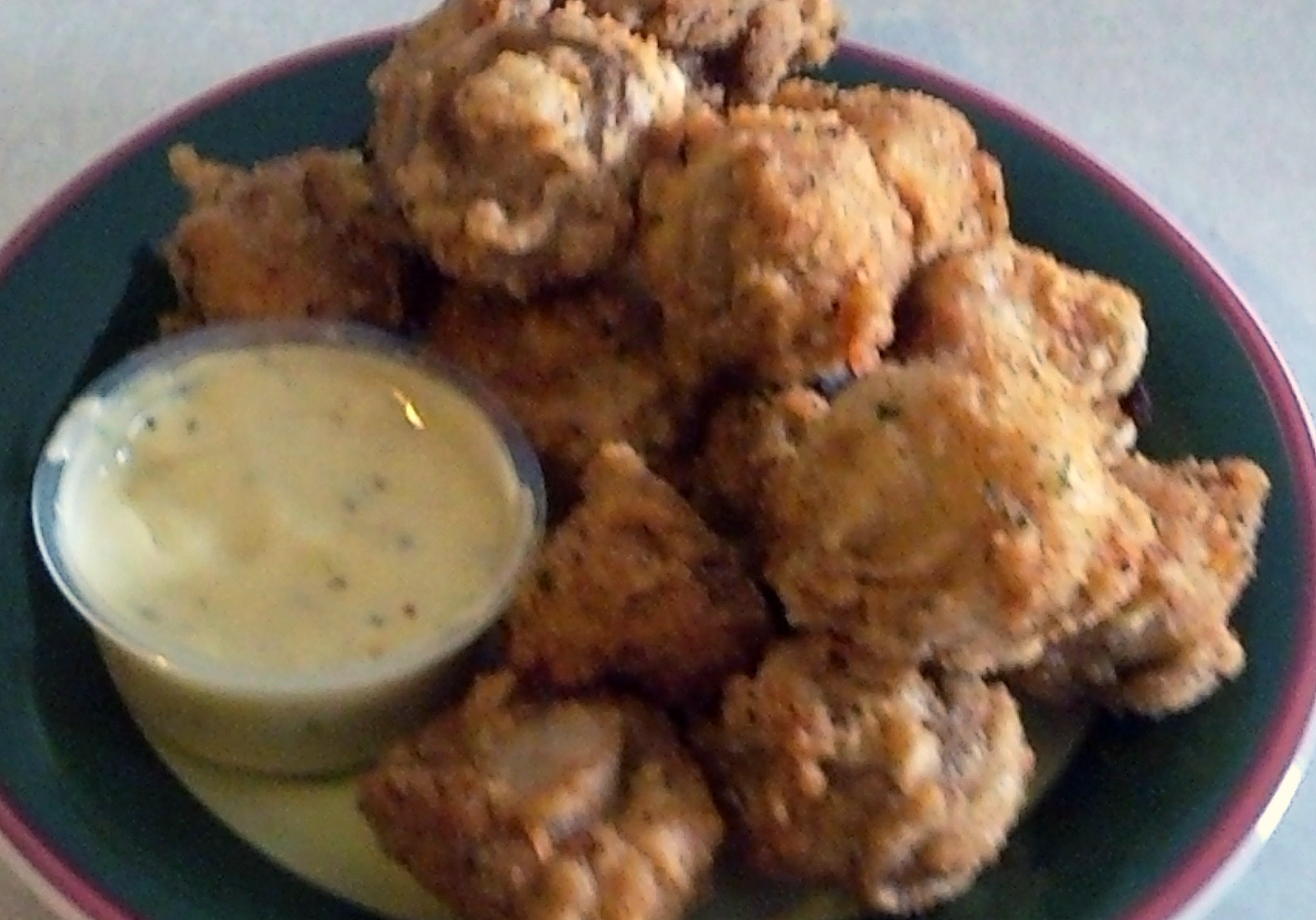 battered and deep fried button mushrooms with a horseradish sauce