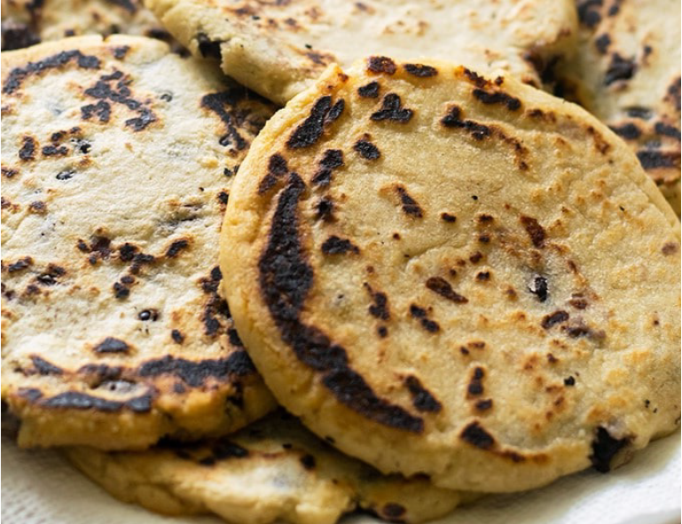 bean and cheese pupusas on a plate
