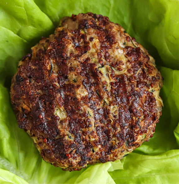 beef and courgette burger on a bed of lettuce