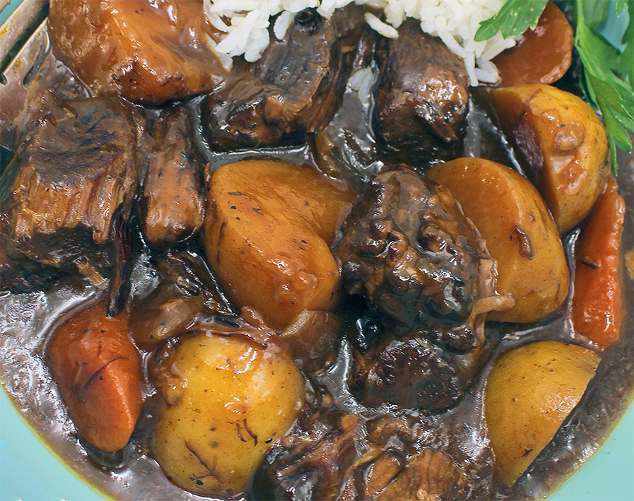 beef mechado stew served on a plate