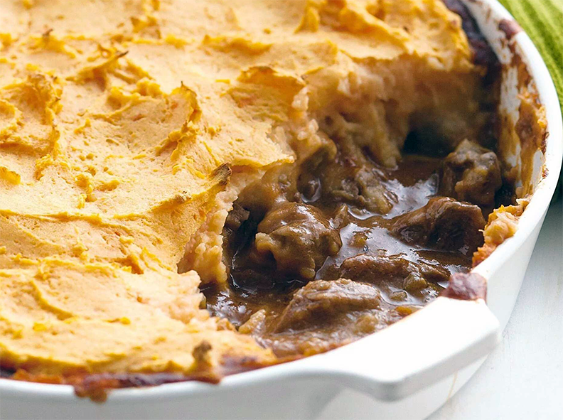 sliced beef in gravy with mashed potato topping