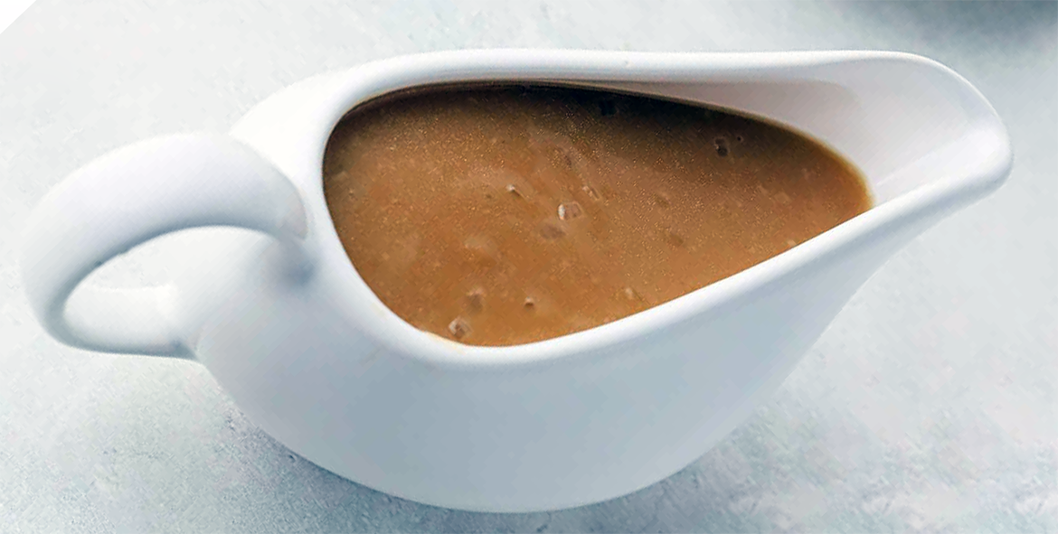 brown gravy in a sauce boat