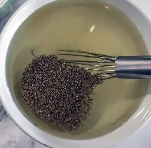 celery seeds whisked into a cup of vinegar