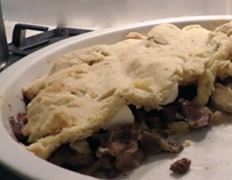 shortcrust topped giblet pie in a pie dish