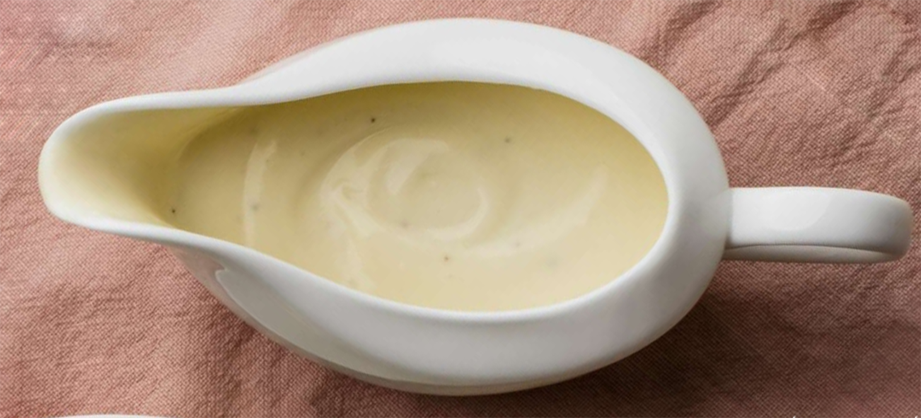 white cream sauce in a sauce boat