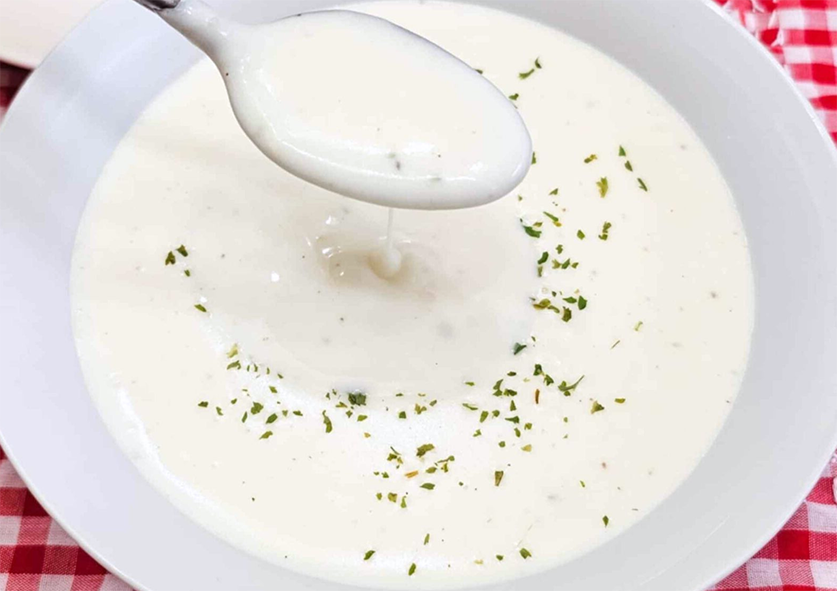 smooth milk soup in a white soup dish