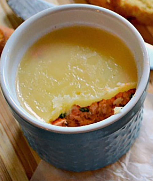 potted salmon topped with butter in a ramekin