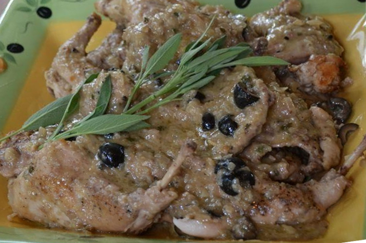 rabbit stewed with butter, sherry and dried mushrooms served topped with a sprig of thyme
