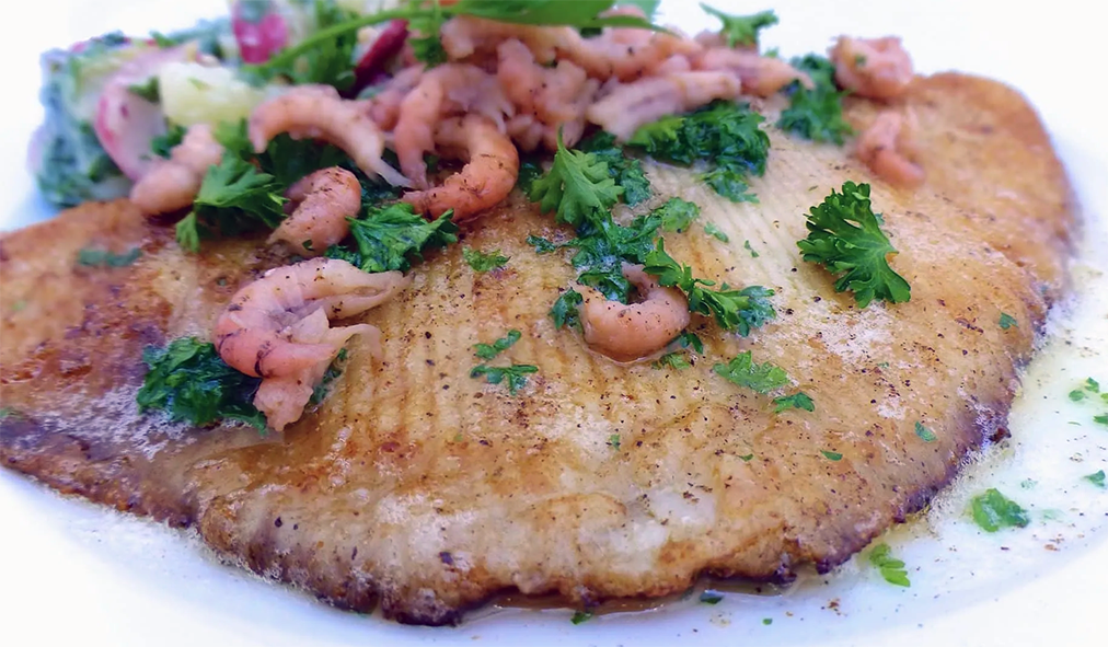 fried skate wing topped with shrimp