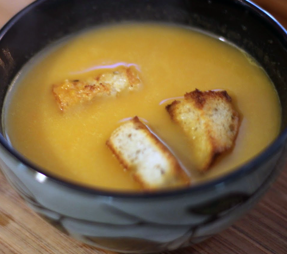 soup a la crecy in a bowl garnished with toasted bread