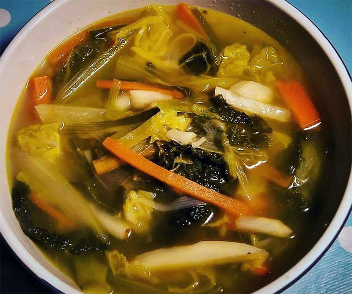 soup of julienned vegetables served over a bread round