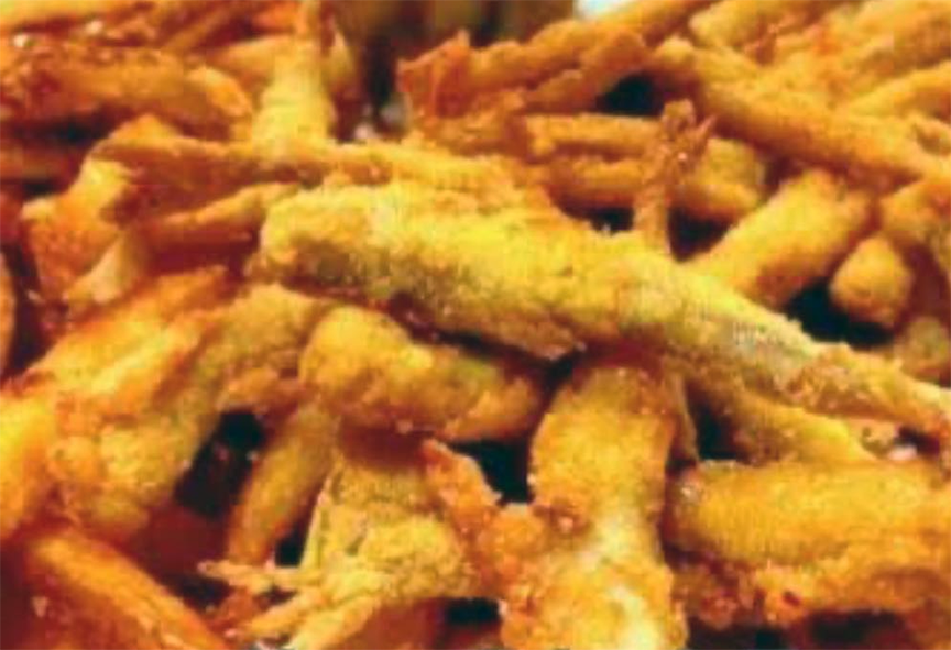 fried breaded smelt arranged on a plate