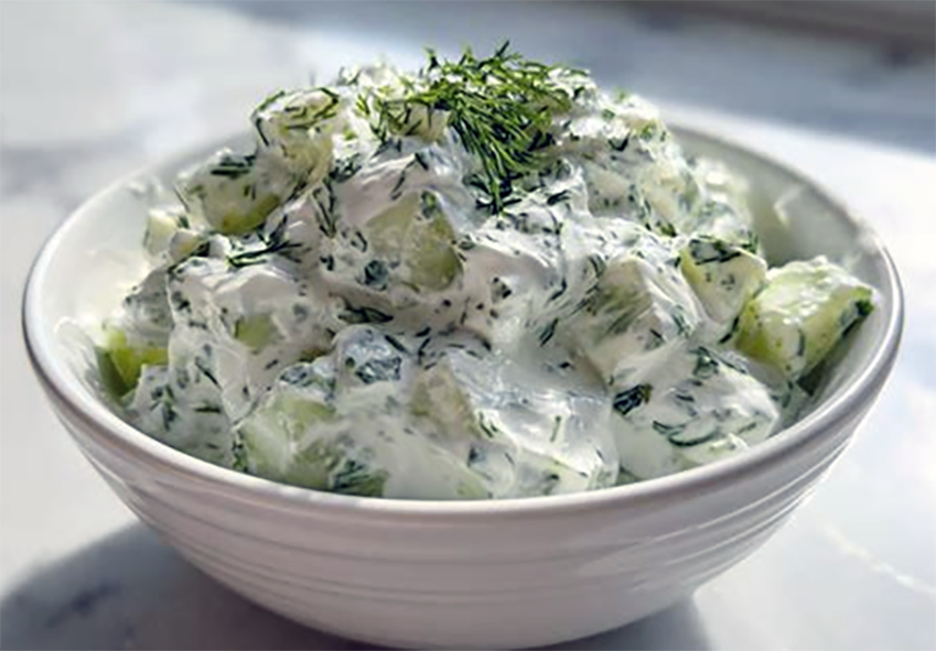 white cucumber sauce mounded in a bowl