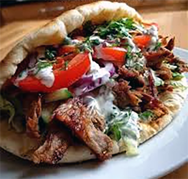 German style flatbread stuffed doner kebab served on a white plate