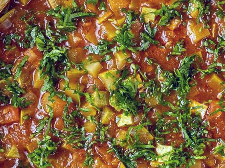 bisort and courgette stew in a casserole dish