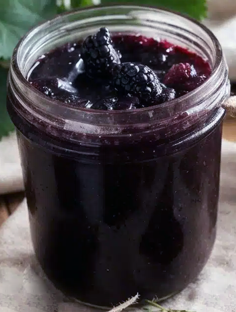 Blackberry and elderberry jam in a glass jar