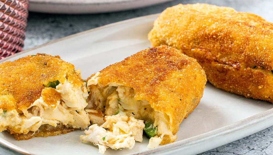 breaded sausages of chicken meat bound with bechamel on a plate