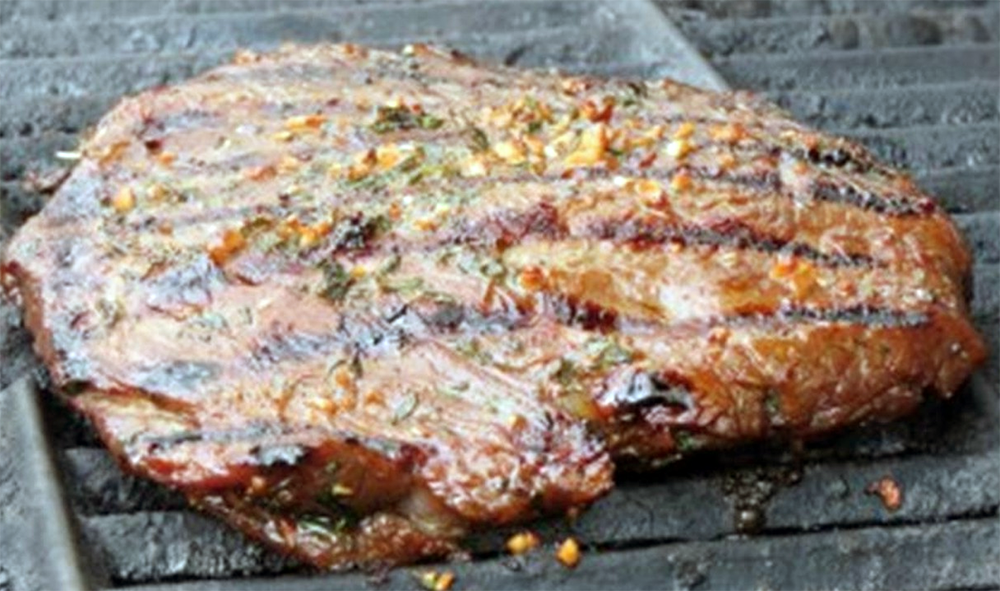 bourbon marinated flank steak on a griddle pan