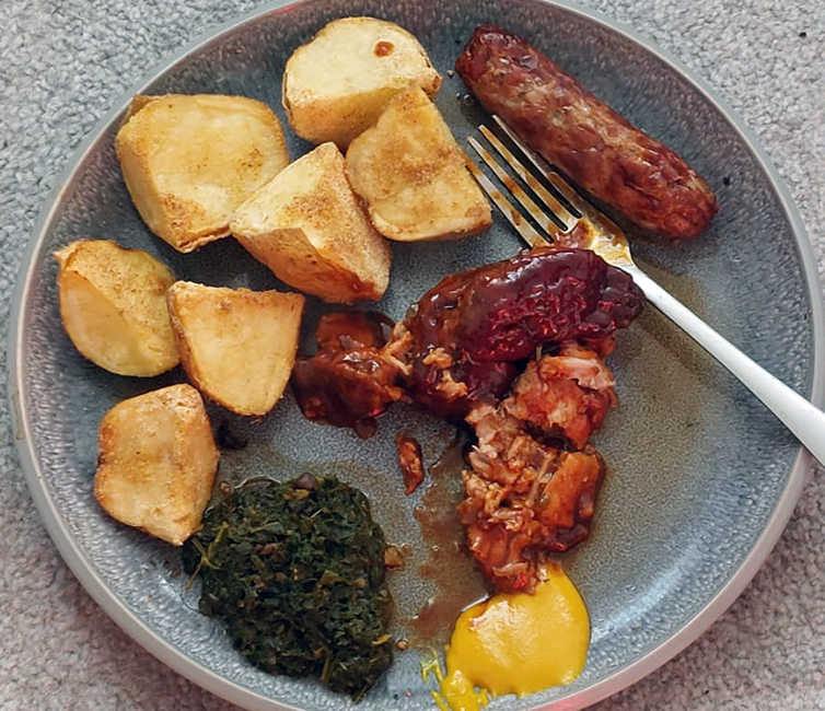 braised Asian flavoured pork served with simmered chopped wild greens, roast potatoes and sausage