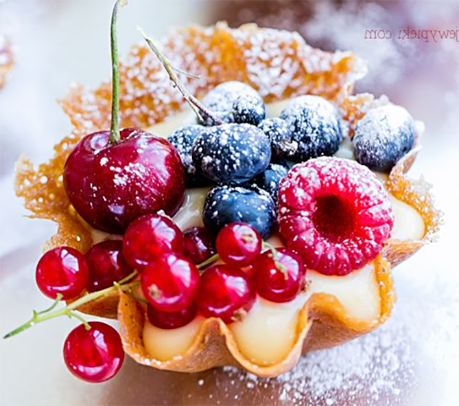 brandy-snap basket filled with pastry cream and fresh summer fruit