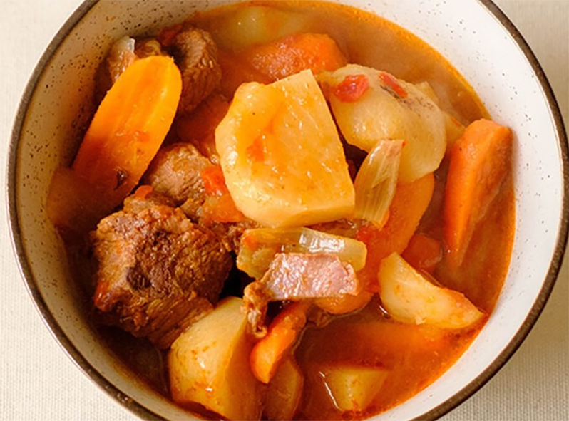 beef, carrot, turnip and onions soup in a soup bowl