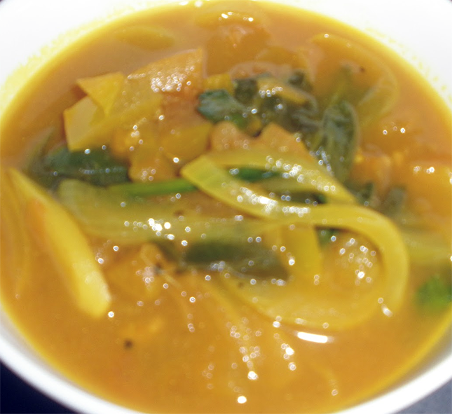 Myanmar chin hin (sour soup) in a white soup bowl