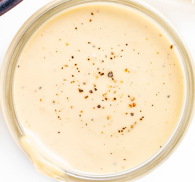 Caesar salad dressing in a glass dish