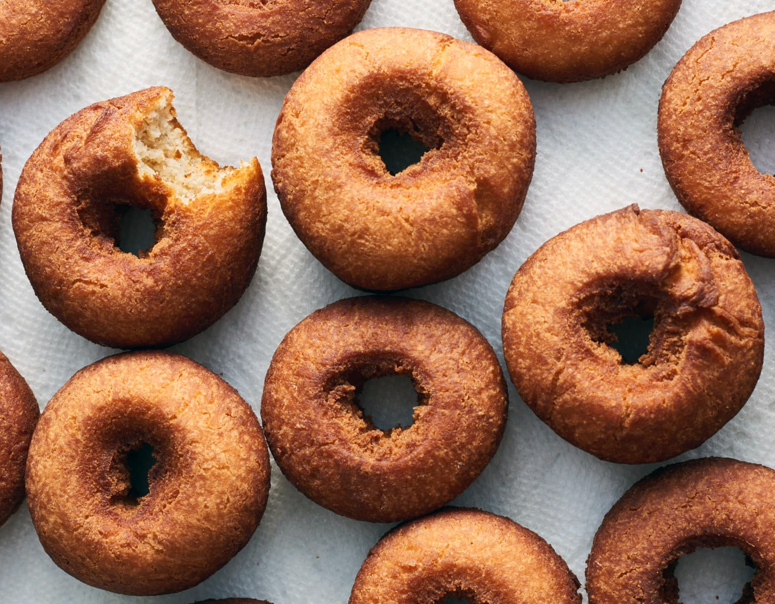deep fried cake doughnuts on kitchen paper